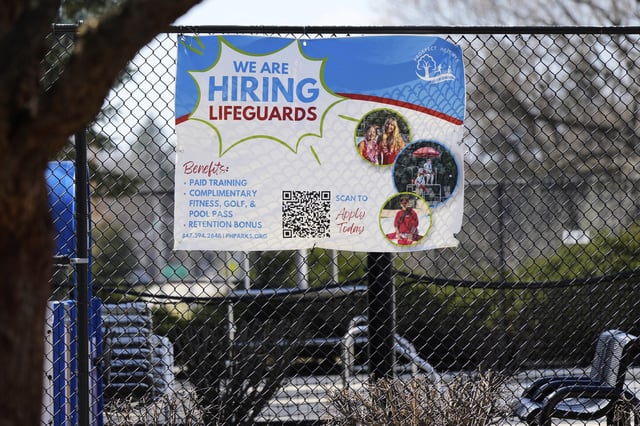 Hiring sign is displayed outside of Prospect Heights Park District in Prospect Heights, Ill., Monday, March 24, 2025. (AP Photo/Nam Y. Huh)