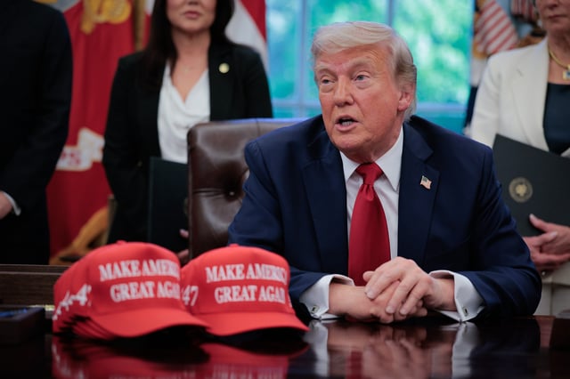 U.S. President Donald Trump speaks to the media after signing executive orders in the Oval Office at the White House on April 23, 2025 in Washington, DC.