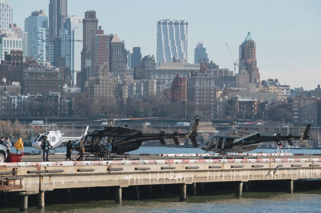 Helicopters are positioned on a heliport on the East River in Downtown Manhattan in 2023.
