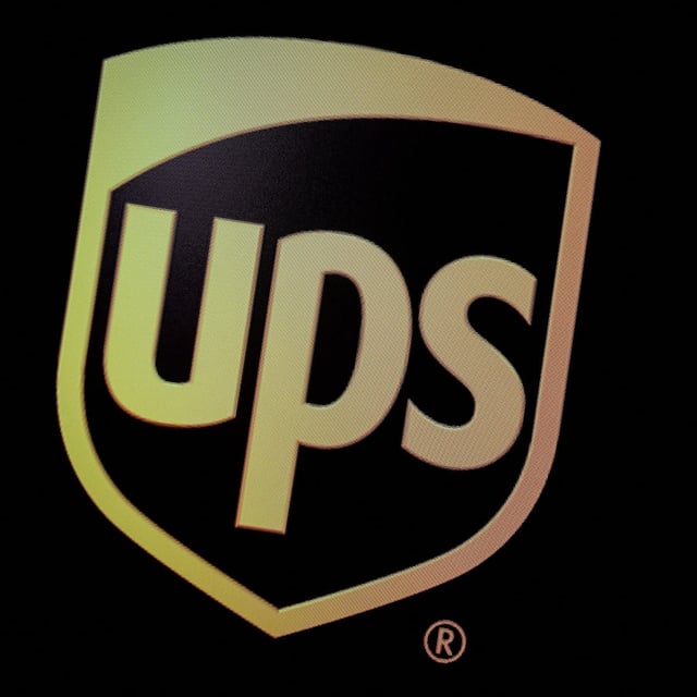 FILE PHOTO: The company logo for United Parcel Service (UPS), is displayed on a screen at the New York Stock Exchange (NYSE) in New York, U.S., October 22, 2019. REUTERS/Brendan McDermid/File Photo