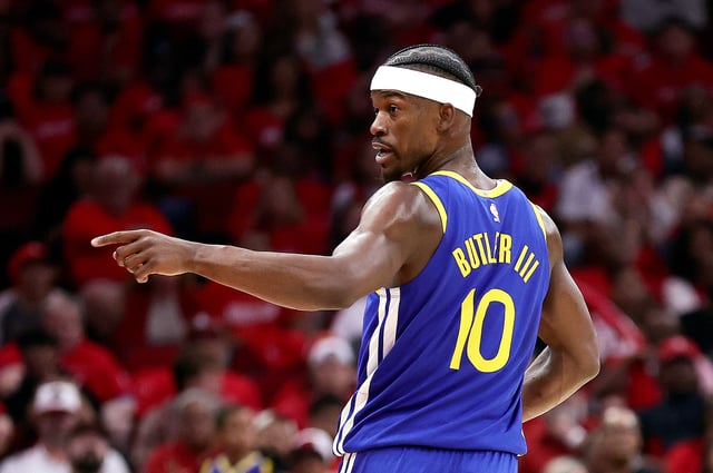 HOUSTON, TEXAS - APRIL 20: Jimmy Butler III #10 of the Golden State Warriors celebrates a three point basket against the Houston Rockets during the third quarter in Game One of the Western Conference First Round NBA Playoffs at Toyota Center on April 20, 2025 in Houston, Texas.