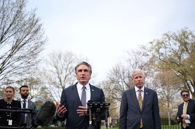 U.S. Interior Secretary Doug Burgum (left) and Energy Secretary Chris Wright speak to reporters outside of the West Wing of the White House in Washington, D.C., on March 19, 2025.