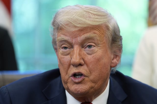 President Donald Trump speaks with reporters after signing executive orders in the Oval Office of the White House, Wednesday, April 23, 2025, in Washington. (AP Photo/Alex Brandon)