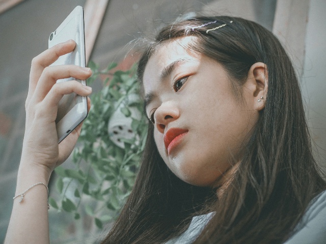 Woman holding smartphone