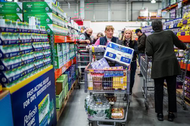 Customers shop at Costco in Niantic, Conn., on April 18, 2025.