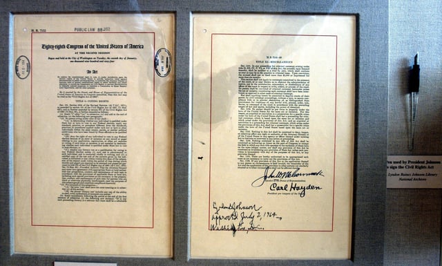 The actual Title VII of the Civil Rights Act of 1964 document and pen is on display in the East Room of the White House in Washington, D.C., July 1, 2004. President Lyndon B. Johnson signed the Civil Rights Act into law on July 2, 1964 and the landmark law prohibits racial discrimination in public accommodations, publicly owned or operated facilities, employment and union membership, and voter registration.