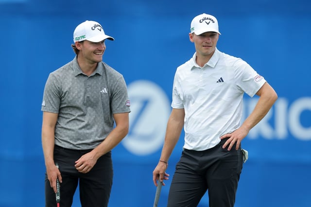 AVONDALE, LOUISIANA - APRIL 24: Rasmus Højgaard of Denmark and Nicolai Højgaard of Denmark speak on the ninth greenon day one of the Zurich Classic of New Orleans on April 24, 2025 in Avondale, Louisiana.