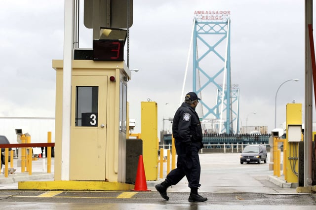 Vehicles enter the United States from Canada across the Ambassador Bridge at a U.S. Customs port of entry in December 13, 2004, in Detroit, Michigan.