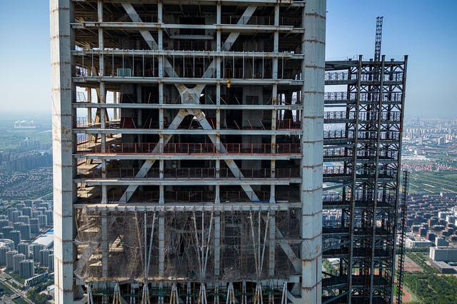 Original plans divided the project into three office zones, with a hotel on the upper floors, according to architects P&T Group.