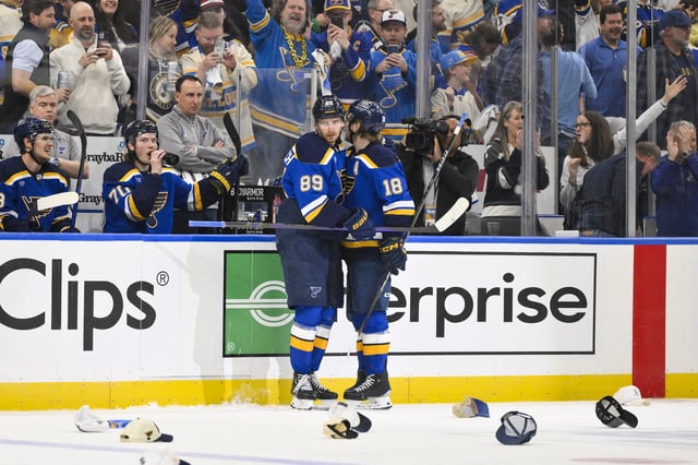 Apr 24, 2025; St. Louis, Missouri, USA; St. Louis Blues left wing Pavel Buchnevich (89) is congratulated by center Robert Thomas (18) after recording a hat trick against the Winnipeg Jets during the third period in game three of the first round of the 2025 Stanley Cup Playoffs at Enterprise Center. Mandatory Credit: Jeff Curry-Imagn Images