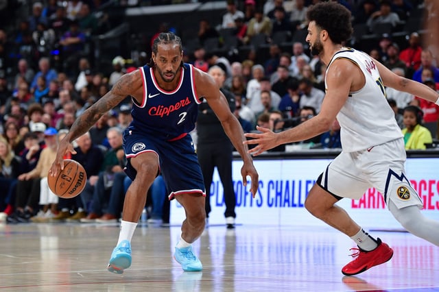 Apr 24, 2025; Inglewood, California, USA; Los Angeles Clippers forward Kawhi Leonard (2) moves the ball against Denver Nuggets guard Jamal Murray (27) during the second half of game three in the first round for the 2024 NBA Playoffs at Intuit Dome. Mandatory Credit: Gary A. Vasquez-Imagn Images