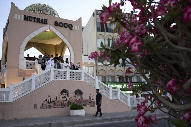 People walk through Mutrah Souq in Muscat, Oman, Friday, April 11, 2025. (AP Photo/ Fatima Shbair)