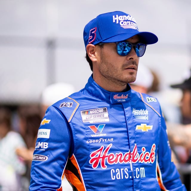 Driver Kyle Larson heads to the track before a NASCAR Cup Series auto race at Darlington Raceway, Sunday, April 6, 2025, in Darlington, S.C. (AP Photo/Scott Kinser)
