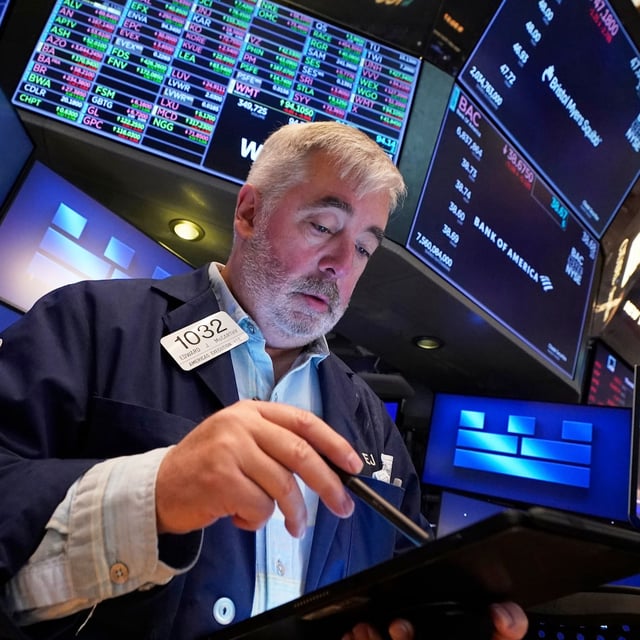 Trader Edward McCarthy works on the floor of the New York Stock Exchange, Thursday, April 24.