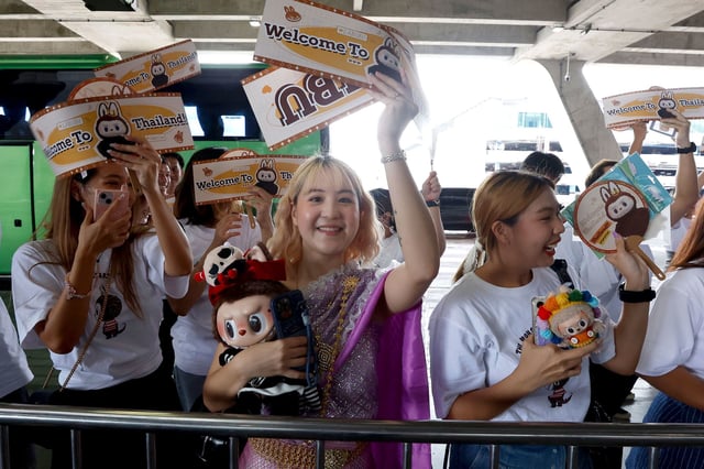 Thai fans wait to meet the character Labubu upon its arrival to Bangkok during a campaign to lure Chinese visitors at Suvarnabhumi International Airport in Samut Prakan province, Thailand on July 1, 2024.