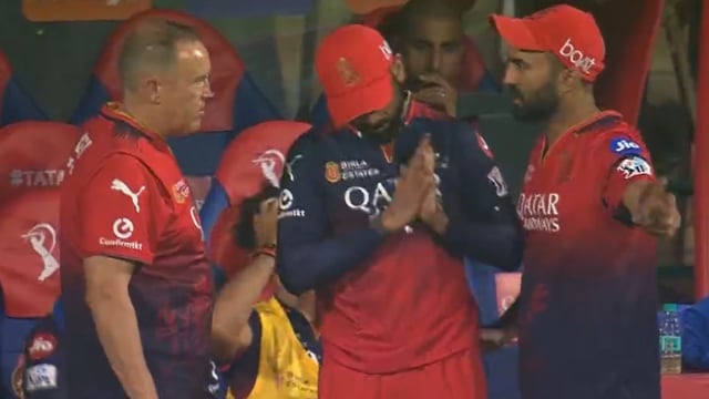 Virat Kohli, centre, wasn't having Dinesh Karthik's suggestion