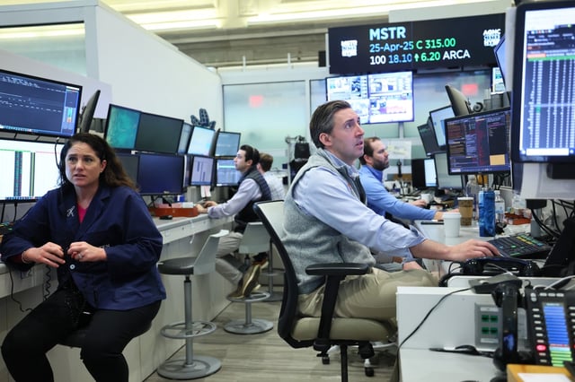 Traders work on the floor of the New York Stock Exchange on Tuesday.