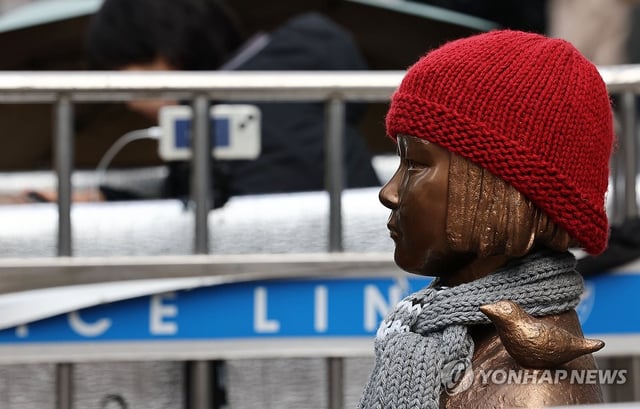 This file photo taken Feb. 28, 2025, shows a comfort women statue with a red hat on in central Seoul. (Yonhap)