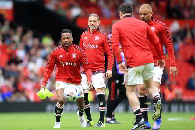 Manchester United&#39;s Patrice Evra (L) warms up with teammates ahead of the Legends of the North football match between Manchester United Legends and Liverpool Legends at Old Trafford in Manchester, north-west England on May 21, 2022.