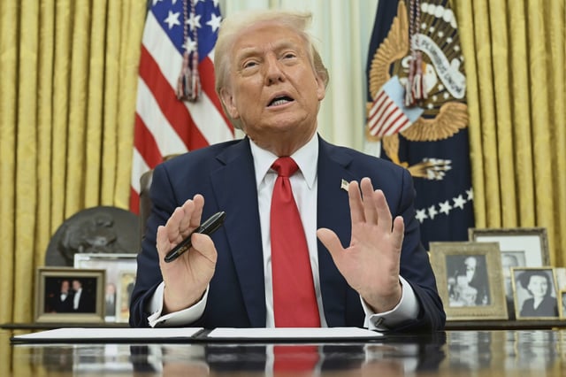 U.S. President Donald Trump speaks to reporters before signing an executive order in the Oval Office of the White House in Washington on Monday, March 31, 2025. THE CANADIAN PRESS/Pool via AP