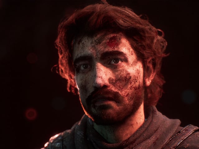 Best Expedition 33 attributes: A close-up shot of Gustave with a haunted facial expression, covered in dirt.