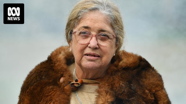 Headshot of Aunty Joy wearing classes and a possum fur coat.