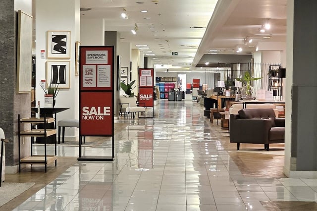 Sale signage is seen at the Hudson's Bay store in Toronto, Tuesday, April 22, 2025. THE CANADIAN PRESS/Giordano Ciampini