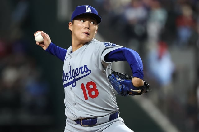 ARLINGTON, TEXAS - APRIL 18: Yoshinobu Yamamoto #18 of the Los Angeles Dodgers pitches during the second inning against the Texas Rangers at Globe Life Field on April 18, 2025 in Arlington, Texas.