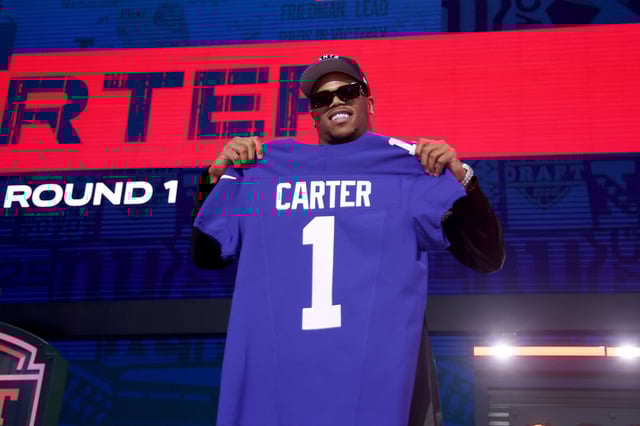 Edge Rusher Abdul Carter of Penn State poses after being selected third overall pick by the New York Giants during the first round of the 2025 NFL Draft at Lambeau Field, in Green Bay, Wisc., on April 24, 2025.