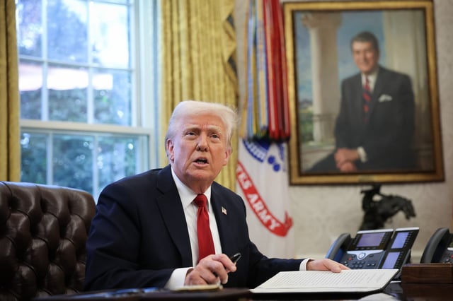 U.S. President Donald Trump speaks to the press before signing an executive order in the Oval Office of the White House on March 26, 2025 in Washington, DC.