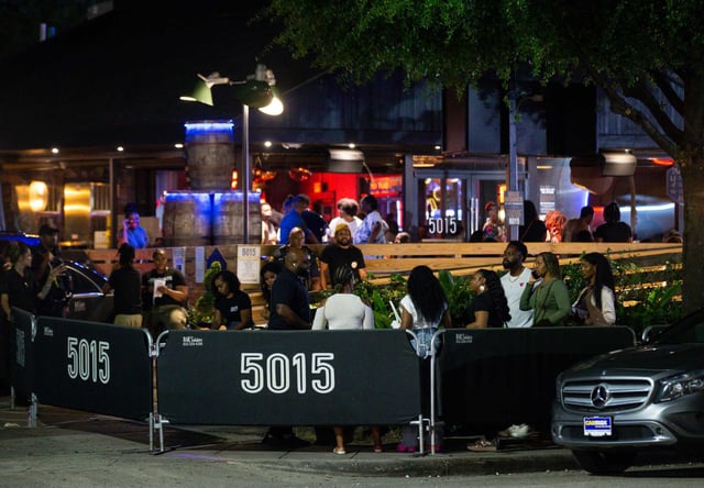 People wait in line to enter Bar 5015 on Almeda Road on Friday, April 29, 2022, in Houston. 