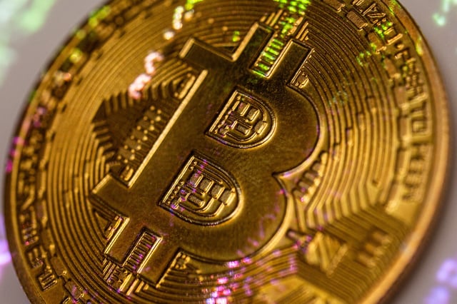 Bitcoin cryptocurrency with the green code from the Matrix movie projected onto it in Clermont Ferrand France on March 26 2025.
