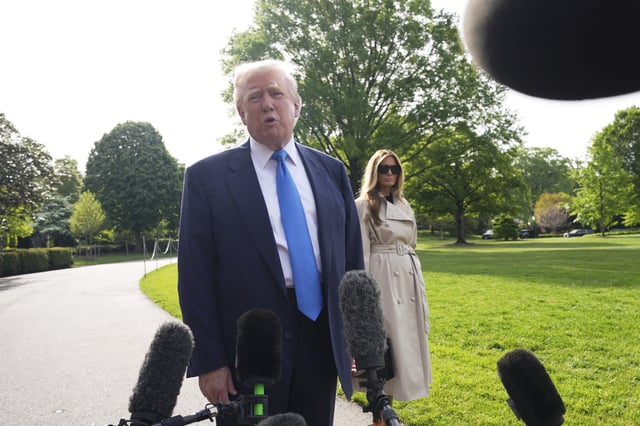 President Donald Trump speaks with reporters as he and first lady Melania Trump depart on Marine One from the South Lawn of the White House, Friday, April 25, 2025, in Washington. The President and first lady will be traveling to Rome and the Vatican to attend the funeral for Pope Francis. (AP Photo/Alex Brandon)