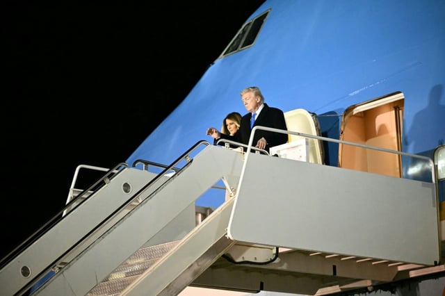 US President Donald Trump and First Lady Melania Trump step off Air Force One in Rome after celebrating her birthday en route to the Pope's funeral