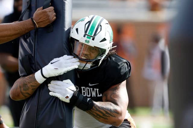 National team defensive lineman Mike Green of Marshall (15) runs through drills during practice for the Senior Bowl NCAA college football game, Wednesday, Jan. 29, 2025, in Mobile, Ala. (AP Photo/Butch Dill)