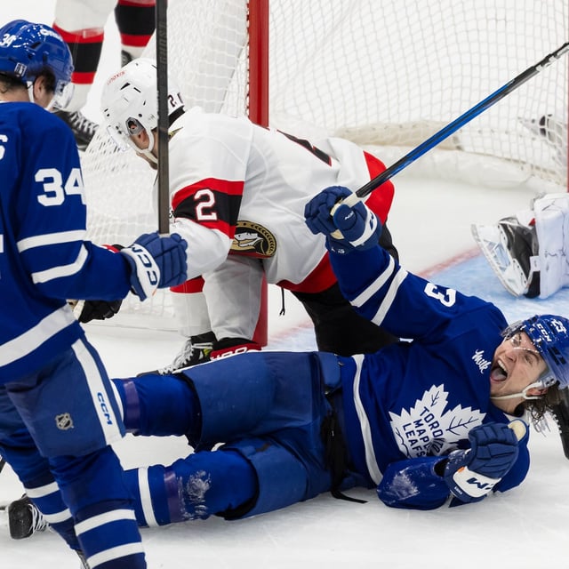 Toronto Maple Leafs’ teammates Matthew Knies (23) and Auston Matthews (34) celebrate a goal against the Ottawa Senators during third period NHL playoff action in Toronto on Sunday, April 20, 2025. THE CANADIAN PRESS/Nick Iwanyshyn