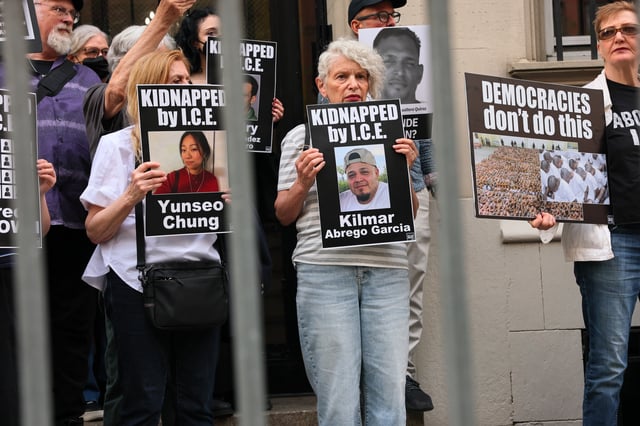 Protesters can be seen holding photos of Columbia student Yunseo Chung and Maryland man Kilmar Abrego Garcia as demonstrators gather to protest against the deportation of immigrants to El Salvador outside the Permanent Mission of El Salvador to the United Nations on April 24, 2025, in New York City. (Photo by Michael M. Santiago/Getty Images)
