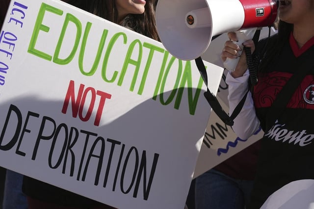 FILE - Students march at Arizona State University in protest of ASU's chapter of College Republicans United-led event encouraging students to report "their criminal classmates to ICE for deportations", Jan. 31, 2025, in Tempe, Ariz. (AP Photo/Ross D. Franklin, File)