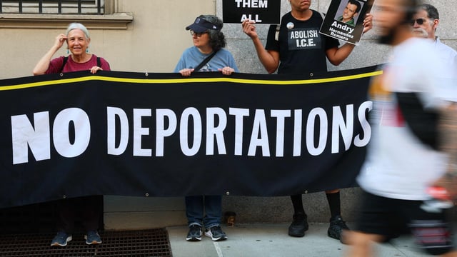Demonstrators gather to protest against the deportation of immigrants to El Salvador.
