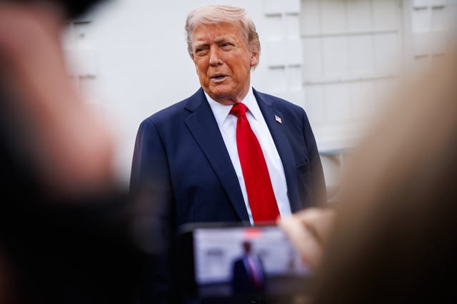 United States President Donald Trump stops to talk to reporters after surveying the North Lawn of the White House on April 23, 2025 in Washington, D.C. Trump said he was looking at where a new flag pole would be installed on the North Lawn, which he claimed to be paying for. Credit: Samuel Corum / Pool via CNP