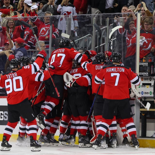 Apr 25, 2025; Newark, New Jersey, USA; New Jersey Devils defenseman Simon Nemec (17) celebrates his game winning goal against the Carolina Hurricanes during the second overtime in game three of the first round of the 2025 Stanley Cup Playoffs at Prudential Center. Mandatory Credit: Ed Mulholland-Imagn Images
