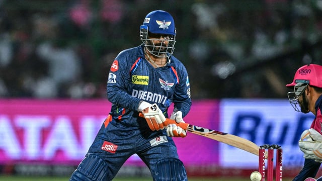 Dhruv Jurel (R) takes a catch to dismiss Lucknow Super Giants' captain Rishabh Pant (L) during the Indian Premier League (IPL)