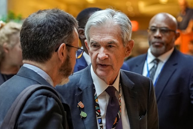 U.S. Federal Reserve Chair Jerome Powell and Pierre-Olivier Gourinchas, chief economist at IMF talk following the IMFC Breakfast at the 2025 annual IMF/World Bank Spring Meetings in Washington, D.C., U.S., April 25, 2025. REUTERS/Ken Cedeno