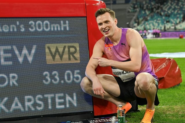 Norway's Karsten Warholm poses with his time of 33.05 seconds after he broke the men's 300m hurdles world record during the Xiamen IAAF Diamond League athletics meeting at Egret Stadium in Xiamen, in China’s eastern Fujian province, on April 26, 2025.