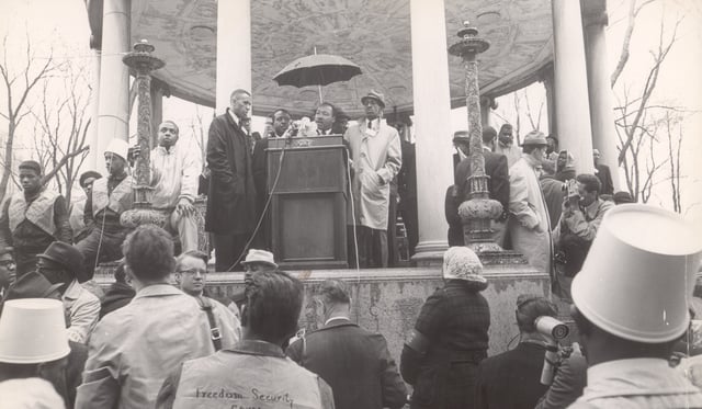 BOSTON – APRIL 23: Dr. Martin Luther King, Jr. speaks from the Parkman Bandstand on the Boston Common at the end of a march through the city to protest segregated housing conditions and racially imbalanced schools, April 23, 1965. (Photo by Joseph Runci/The Boston Globe via Getty Images)