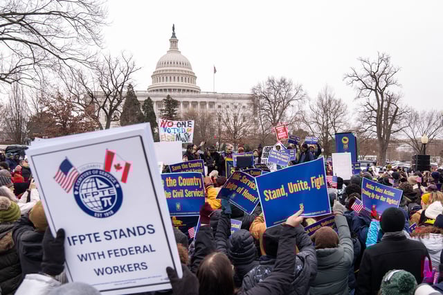 Protesters gather at a rally organized by the American Federation of Government Employees against the so-called Department of Government Efficiency purges and resignation offers made to the federal civilian workforce outside the US Capitol in Washington, DC, on February 11.