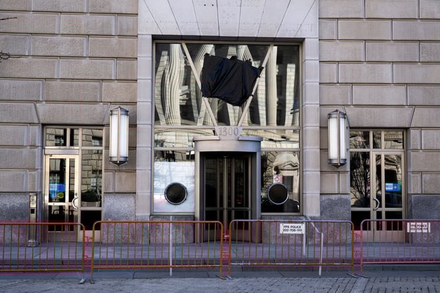 The entrance to the now shuttered USAID office can be seen as black plastic covers a USAID sign at the Ronald Reagan Building and International Trade Center in Washington, DC on April 1.