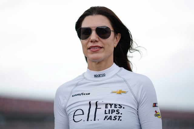 TALLADEGA, ALABAMA - APRIL 25: Katherine Legge, driver of the #32 e.l.f. Cosmetics Chevrolet, walks the grid during qualifying for the NASCAR Xfinity Series Ag-Pro 300 at Talladega Superspeedway on April 25, 2025 in Talladega, Alabama. (Photo by Sean Gardner/Getty Images)