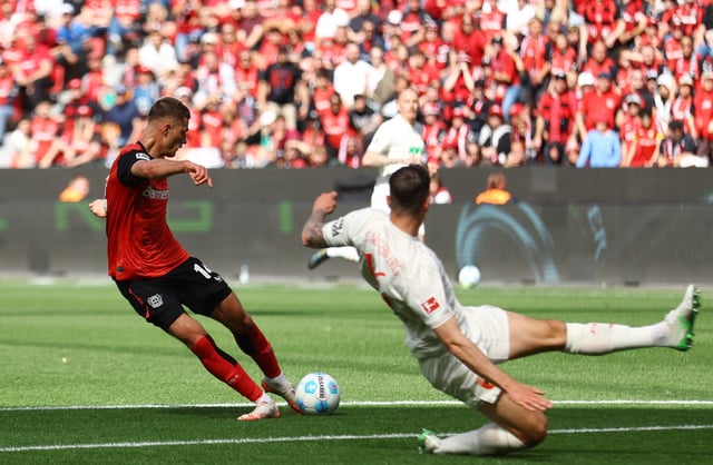 Soccer Football - Bundesliga - Bayer Leverkusen v FC Augsburg - BayArena, Leverkusen, Germany - April 26, 2025 Bayer Leverkusen's Patrik Schick scores their first goal REUTERS/Thilo Schmuelgen