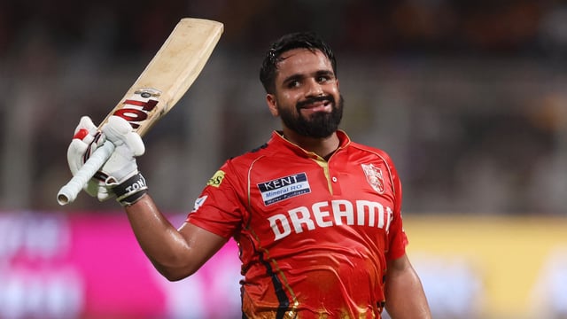 Punjab Kings' Prabhsimran Singh acknowledges the crowd as he walks back
